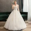 Luxurious wedding dress with long sleeves and an elegant train for a fairytale princess look