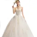 Luxurious wedding dress with long sleeves and an elegant train for a fairytale princess look