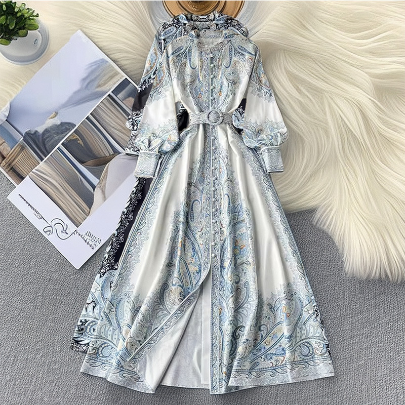 Elegant printed women's dress featuring a classic lapel collar and lantern sleeves that add a refined feminine touch