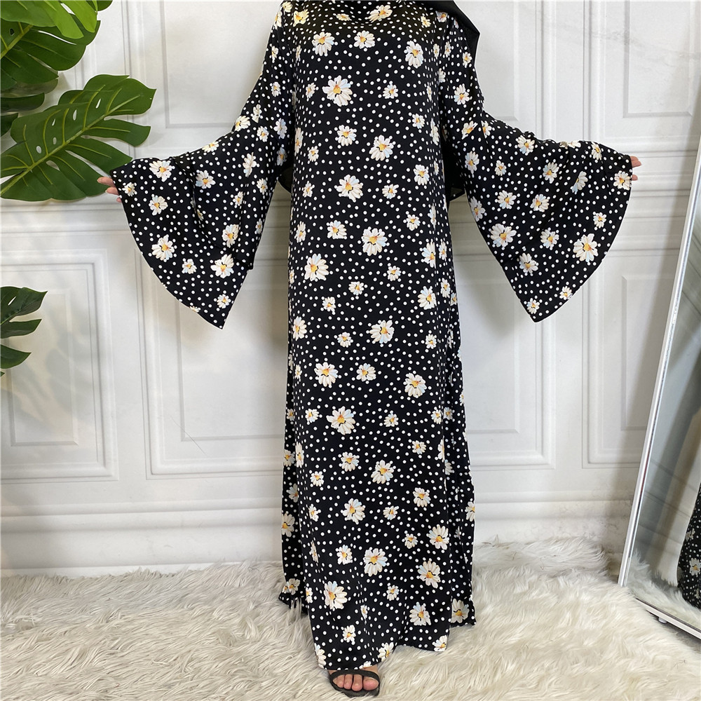 An elegant and modern long satin dress, adorned with floral patterns 