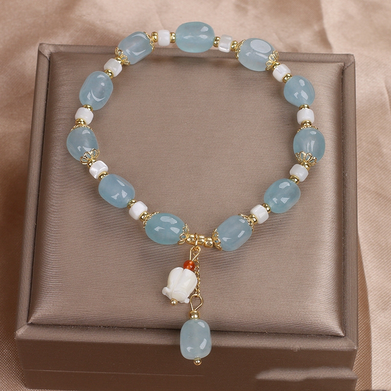An elegant misbaha adorned with aquamarine crystal stone