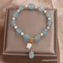 An elegant misbaha adorned with aquamarine crystal stone