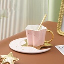 A creative ceramic coffee cup set with a saucer decorated with a star and crescent 