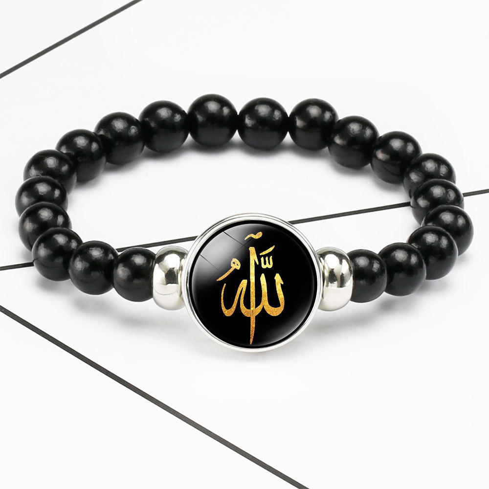 An elegant bracelet with an Islamic touch, adorned with bead charms and snap buttons for a refined and distinctive look