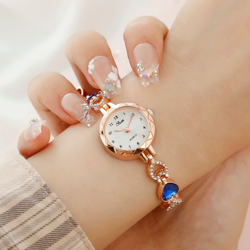 A luxurious women's watch with a simple design, featuring quartz movement and an elegant jewelry-like bracelet