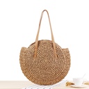 A simple round straw bag with a one-shoulder design, crafted using unique weaving techniques