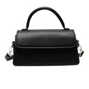 A small bag with an elegant square design, ideal for wearing on the shoulder, that adds a luxurious modern touch to your look