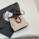 A crossbody bag with a simple and elegant design, inspired by the summer vibe, blending comfort and style