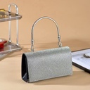 A luxurious handbag fully adorned with sparkling crystals, combining elegance and sophistication 