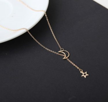 A short necklace with a chain featuring an attractive moon and star design, perfect for adding an elegant touch to your look 