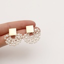 Elegant earrings with a woven pearl scalloped design, carefully handmade to add a touch of sophistication to your look