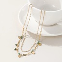 An elegant necklace featuring a combination of green malachite stones, perfect for adding a bold and modern touch to your look