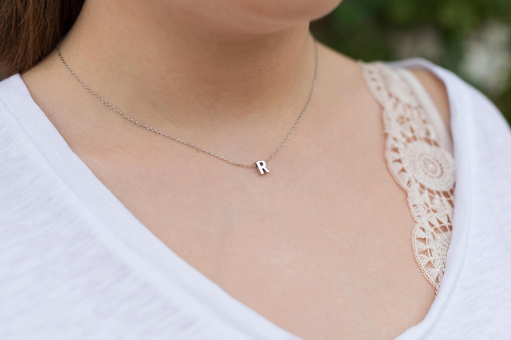 A complete set with an elegant, modern, and attractive design, including an alphabet letter necklace