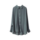 Elegant women's loose-fit shirt in a solid color with long sleeves, made from soft silky fabric and featuring a modern design