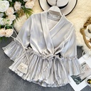 Stand out with an elegant look in this stylish women's blouse, designed with wide sleeves and luxurious details