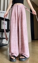 High-waisted wide-leg pants with a modern design, offering an elegant and stylish look