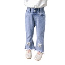 Girls' jeans with a Korean-style wide-leg design, made from comfortable stretch fabric and adorned with elegant feminine details like a bow — offering a modern and practical look