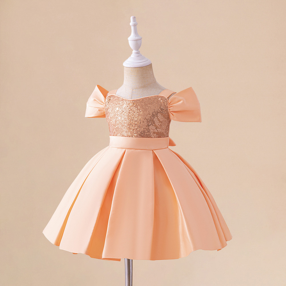 Girls' party and occasion dress with an elegant suspender design, adorned with shiny sequins and luxurious fabric for a stunning and glamorous look