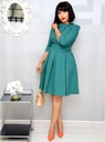 An elegant solid-color dress featuring a round neckline, refined embroidery at the waist, and delicate stitching details that give you a stylish and feminine look