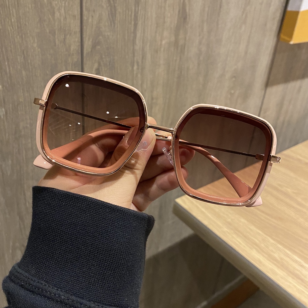 Retro women's sunglasses with a large square frame and elegant classic design