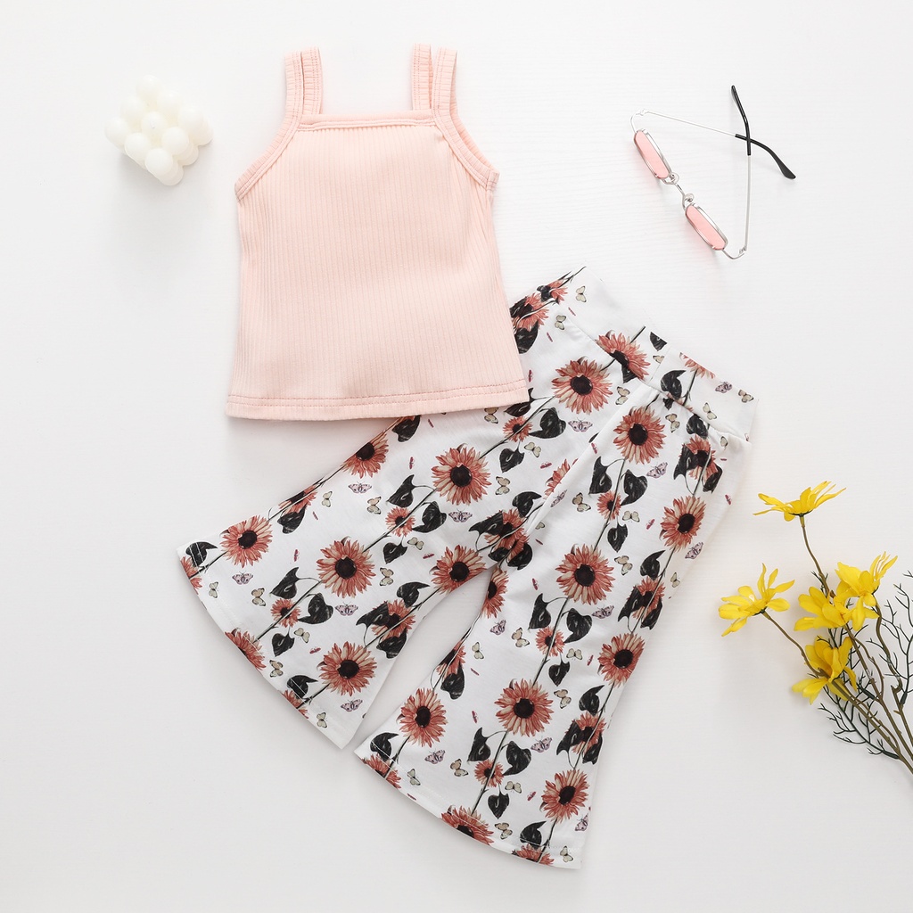Summer girls' outfit consisting of a camisole-style blouse and elegant trousers