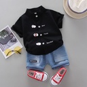 Trendy children's outfit with a unique design – cartoon character print shirt paired with stylish shorts for a bold and playful look
