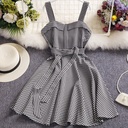 Korean-style sleeveless plaid dress with a defined waist and A-line cut for an elegant feminine look