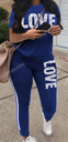 Pajama set featuring a top with letter print and sporty pants designed for practical and comfortable everyday wear