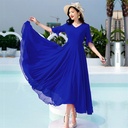 Elegant plus-size long dress above the knee, featuring a summery design perfect for various daily looks and occasions