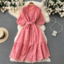 Women's dress featuring puff sleeves, a V-neckline, and elegant hollow-out details for a feminine and stylish look