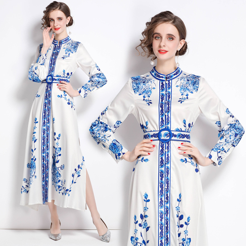 Dress with a stand collar, front button design, and an elegant slit for a feminine look that blends sophistication and modern style