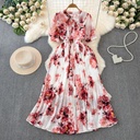 Long chiffon dress with a slim fit top and wide hem, featuring a bow-tie collar and elegant lace-up detail — perfect for vacation looks and summer occasions