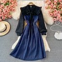 Mid-length dress with a high waist and slimming fit, featuring color-block design and butterfly details for a soft, feminine touch