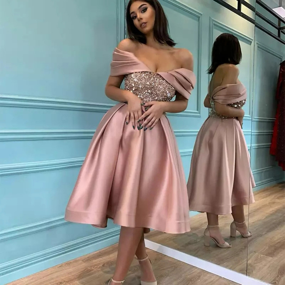 Elegant and feminine women's long dress with a simple off-shoulder design, embellished with sequins for a stylish and eye-catching look