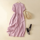 Modern relaxed-fit dress made of cotton and linen, featuring a round doll collar and short sleeves for a comfortable and elegant look