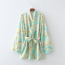 Retro-style women's shirt with elegant prints and a bow-knot detail, featuring long sleeves and a feminine vintage-inspired look