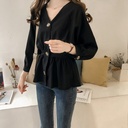 Elegant women's blouse made of cotton and linen, featuring a V-neck and long sleeves with a modern Western design—perfect for everyday looks