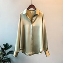Elegant women's satin shirt with long sleeves and a silky texture, perfect for formal and modern looks