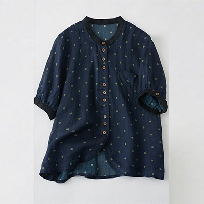 Elegant women's shirt made of natural ramie fabric, adorned with polka dot print and a feminine classic touch