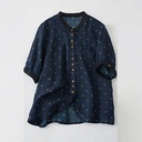 Elegant women's shirt made of natural ramie fabric, adorned with polka dot print and a feminine classic touch