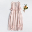 Elegant solid-color dress featuring a round neckline and delicate embroidery