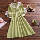 Loose-fitting women's dress with long sleeves and an elegant collar