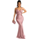 A fitted, solid-color dress featuring strap detailing for an alluring feminine look