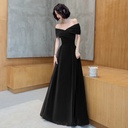 An off-shoulder evening dress that adds an elegant feminine touch