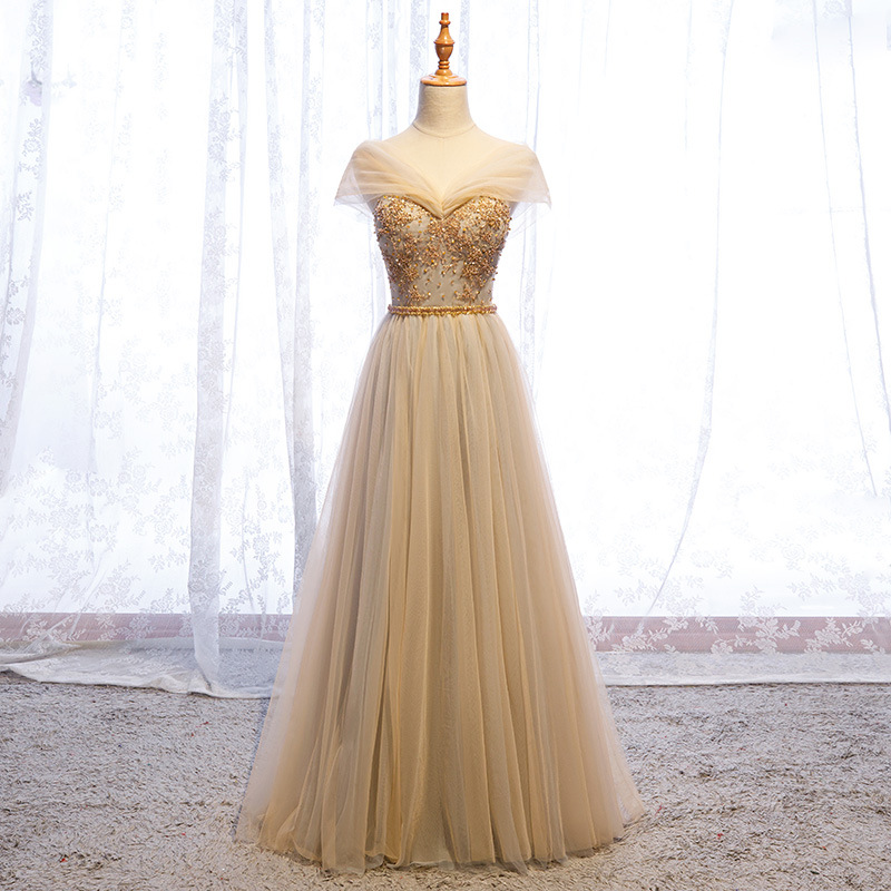 A long evening gown that blends elegance and allure with its flowing, relaxed silhouette