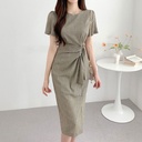 A women’s dress with a round neckline and a wrap-tie waist