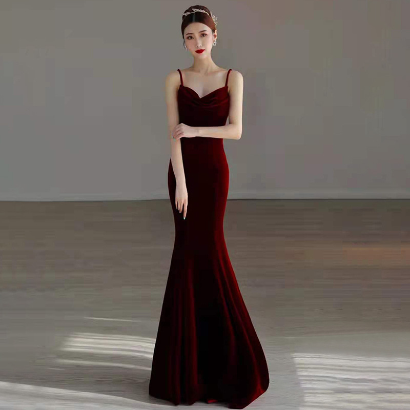 A mermaid-style evening gown featuring elegant thin straps
