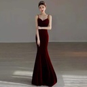 A mermaid-style evening gown featuring elegant thin straps