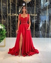 A long sequined evening gown with a full skirt and slim shoulder straps
