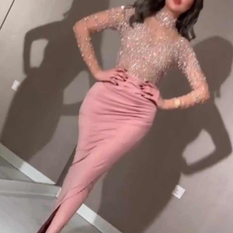 A long-sleeve evening gown with a full skirt for a feminine look